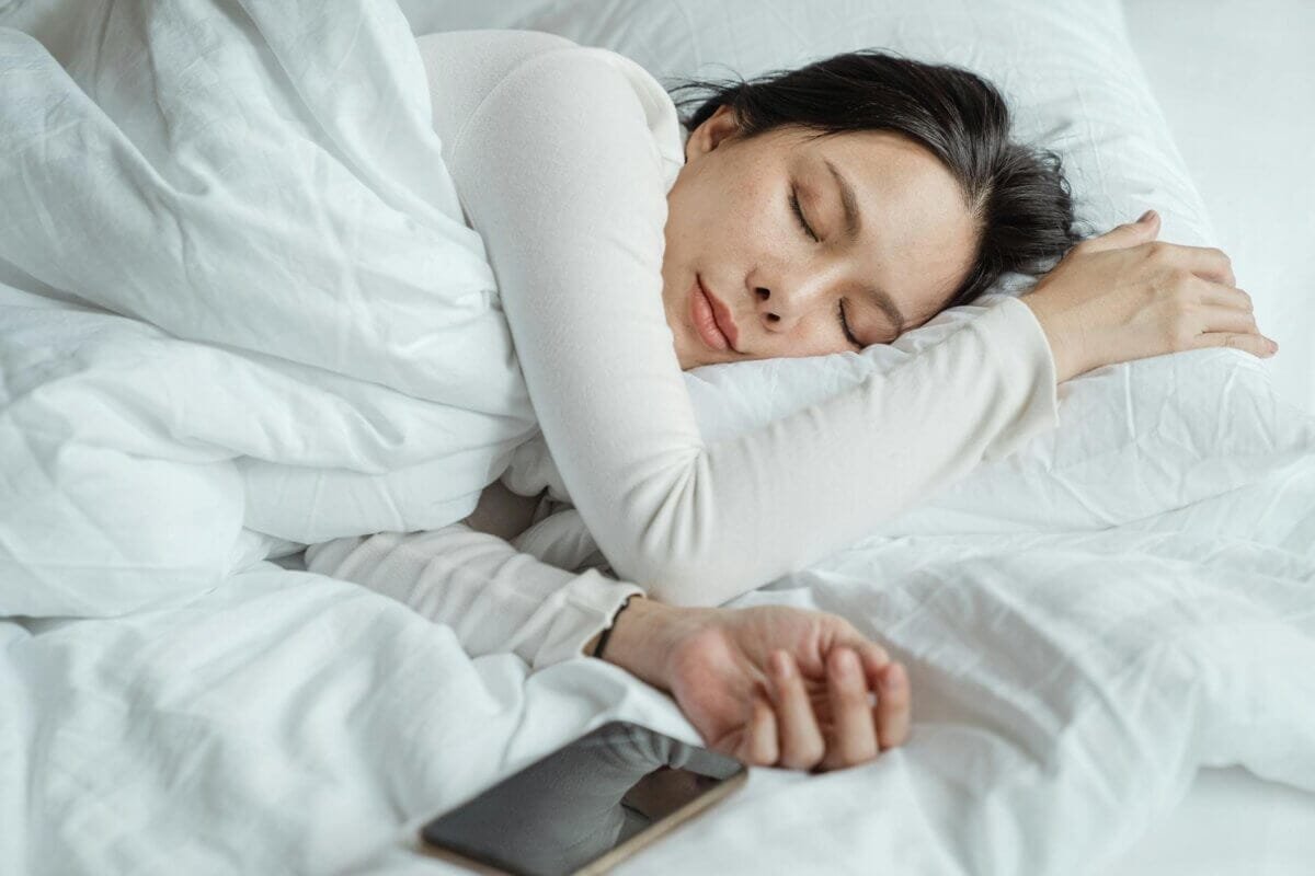 How to Master Your CBD Dosage Chart: A Simple Guide to Daily Wellness 2 woman sleeping in bed near smartphone